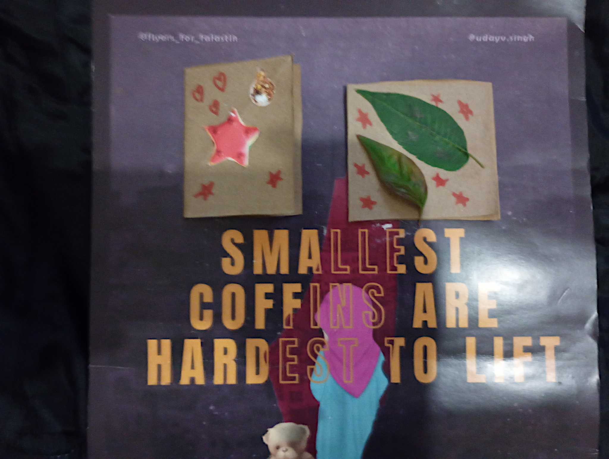 Xmas cards I received from two children set on a poster that reads, "The smallest coffins are the hardest to lift." 